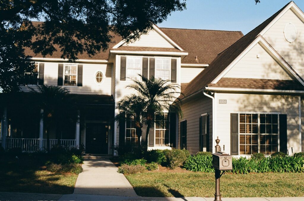 A large, two-story house with a covered porch