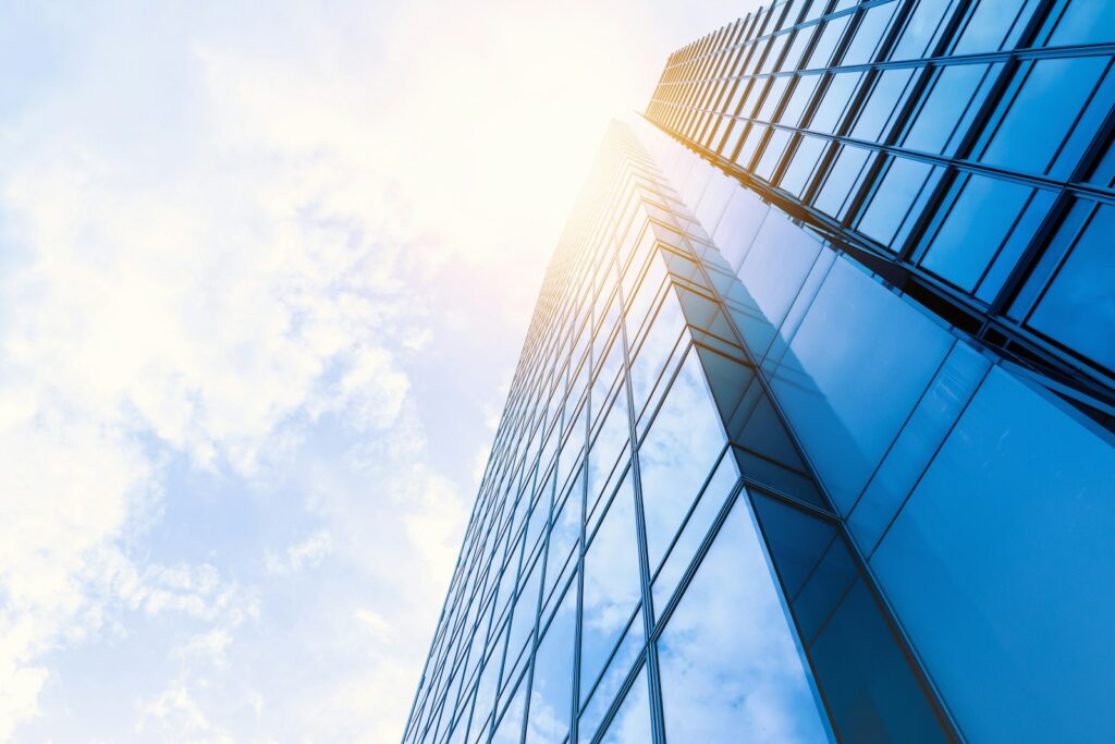 US Market Entry for Foreign Companies: Branch vs. Subsidiary, Compared on Tax and Legal Liability Low-angle photo of a glass office building