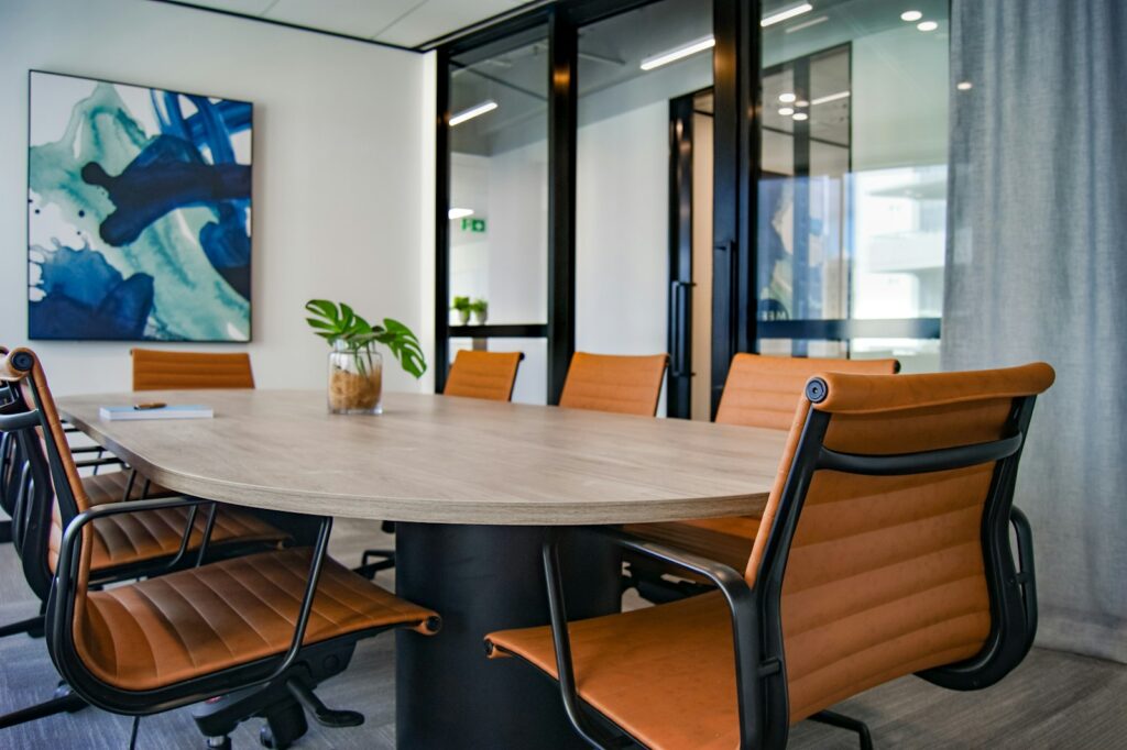 Wooden conference table and chairs in a meeting room